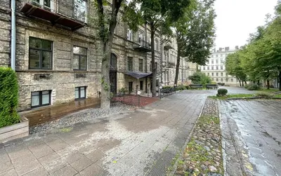 an empty street in front of a brick building at New Town Home 3 in Vilnius