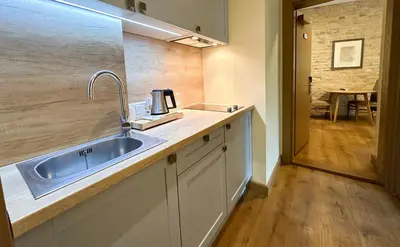a kitchen with a sink and a counter top at New Town Home in Vilnius