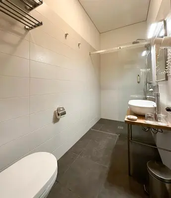 a bathroom with a toilet and a sink at New Town Home in Vilnius