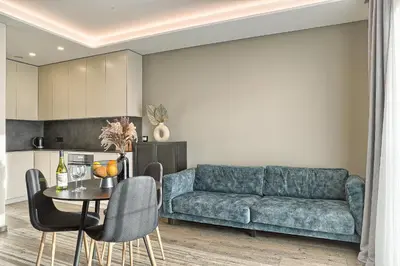 a living room with a couch and a table at Amazing central apartments x free parking x SELF CHECK IN 24x7 in Vilnius