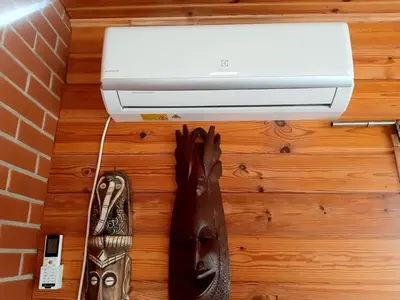 a pair of shoes sitting next to a printer at Marių Kalvos in Palėvenėlė