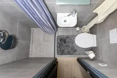 a bathroom with a sink and a mirror at Rasytes 10 in Kaunas