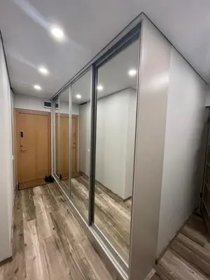 an empty room with glass walls and a hallway at Jaukus butas Jonavoje in Jonava