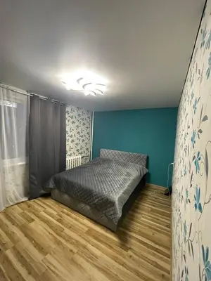 a bedroom with a bed in a room at Jaukus butas Jonavoje in Jonava