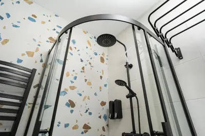 a gym with a rock climbing wall and a mirror at Studio Chic in Vilnius
