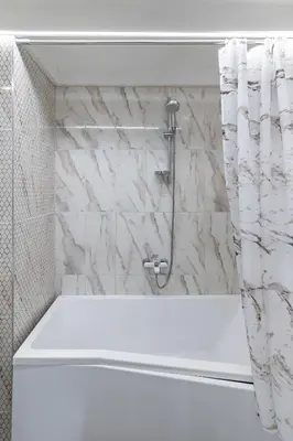 a bathroom with a shower with a white tub at Shanti barracks apartment #2 by Polo Apartments in Kaunas