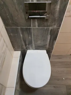 a bathroom with a white toilet in a room at Tokyo Vibes - Private Sleeping Pods Hostel, Self check-in in Vilnius