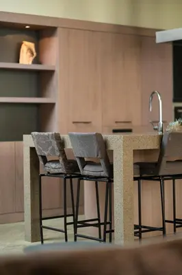 a kitchen with a counter with chairs and a sink at Spacious, Very cosy, Stylish and Perfectly located in Vilnius