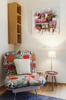 a living room with a couch and a table at Ballare Druskininkai in Druskininkai