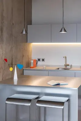 a kitchen with a counter with two stools at Authentic 1 BD Apartment by Domvia in Kaunas
