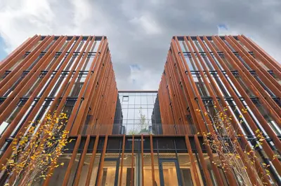 two tall brown buildings next to each other at Authentic 1 BD Apartment by Domvia in Kaunas