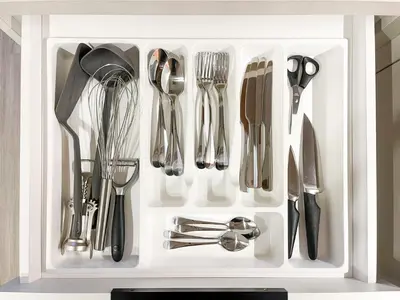 a white drawer filled with utensils in a kitchen at thePilots in Kaunas