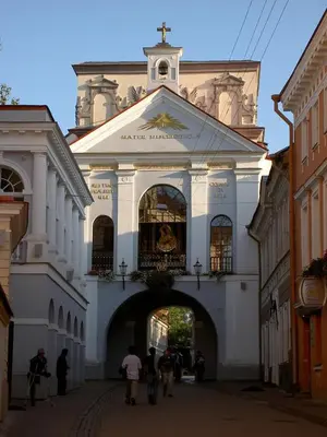 a large white building with an archway in a street at freeparking apartment in VNO