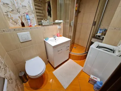 a bathroom with a toilet and a sink and a shower at freeparking apartment in VNO