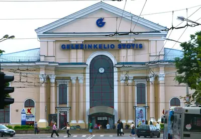 a large building with people walking in front of it at freeparking apartment in VNO