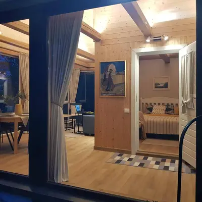 a room with a bedroom with a bed and a window at Svedaso Lake House with Sauna in Svėdasai