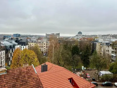 a view of a city with a red roof at Apartamentai Kauno centre in Kaunas