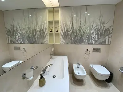 a bathroom with two toilets and a sink at West Side Druskininkai in Druskininkai