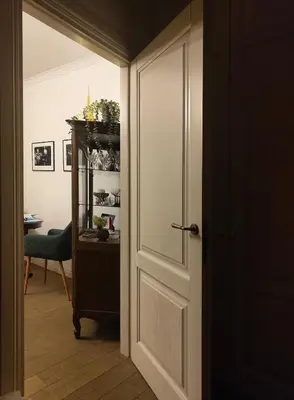 a door leading into a room with a table at Old Town Apartment on quiet private street in Vilnius