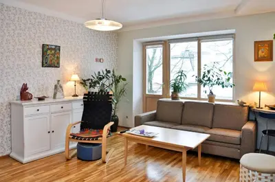 a living room with a couch and a table at Lovely room in a centrally located flat in Vilnius