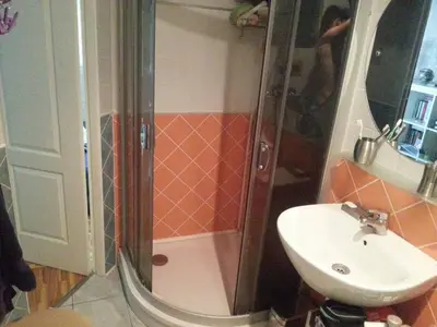 a bathroom with a shower and a sink at Lovely room in a centrally located flat in Vilnius