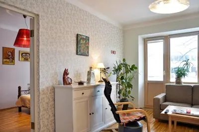 a living room with a couch and a table at Lovely room in a centrally located flat in Vilnius