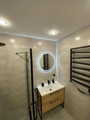 a bathroom with a sink and a mirror at Lamėsto Krantas in Saldutiškis