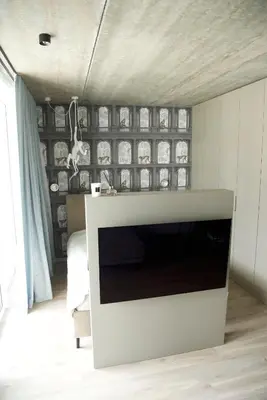 a living room with a white fireplace in a room at Ralio apartamentai monkey in Vilnius