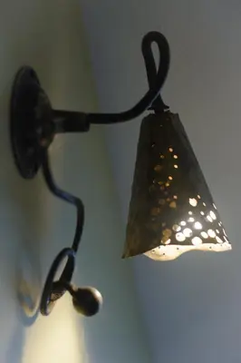 a lamp that is hanging from a ceiling at Gallery Guest Rooms in Kernavė