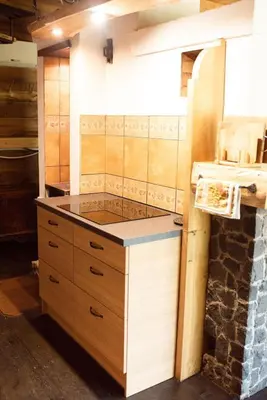 a kitchen with a counter top in a room at Pakaso sodyba, šiaurinė pusė in Kirdeikiai