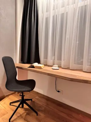 a desk with a chair in front of a window at Parko rezidencija apartments II - SELF CHECK-IN in Panevėžys
