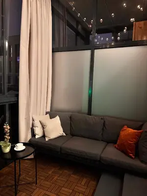 a living room with a couch and a table at Parko rezidencija apartments II - SELF CHECK-IN in Panevėžys