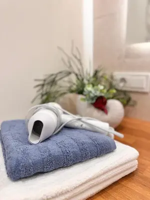 a pair of headphones sitting on top of a blue towel at Parko rezidencija apartments II - SELF CHECK-IN in Panevėžys