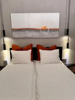 two beds sitting next to each other in a bedroom at Parko rezidencija apartments II - SELF CHECK-IN in Panevėžys