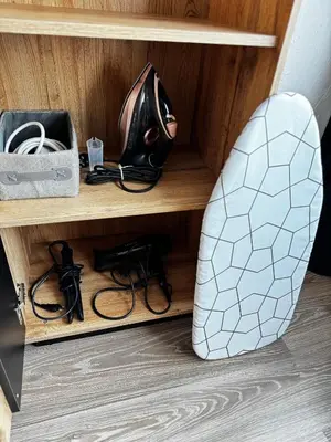 a helmet sitting on a shelf next to a helmet at Gold & Black in Kėdainiai