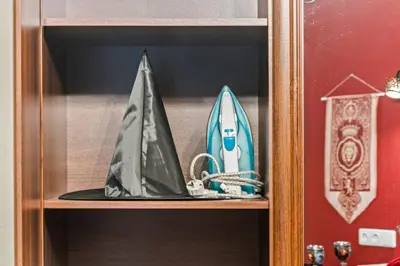 a wooden shelf with a toy boat on it at Blue Oasis and Wizard's Hideaway apartments in Kaunas