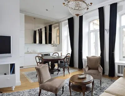a living room with a table and chairs at Cosy Old Vilnius in Vilnius