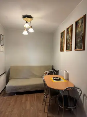 a room with a bed and a table with chairs at Danarent Tilto in Vilnius