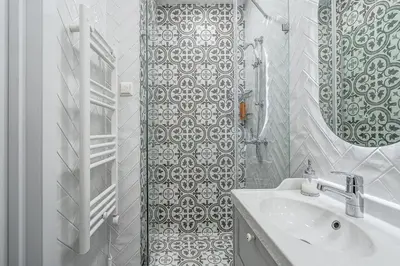 a white bathroom with a sink and a mirror at Angel House Vilnius, 47 in Vilnius