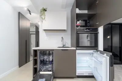 a kitchen with a sink and a dishwasher at Old Town Jacuzzi in Vilnius