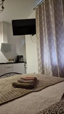 a bed with two towels on top of it at Kaunas Studios - RentA 18 in Kaunas