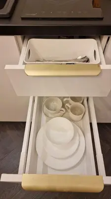 a drawer with plates and utensils in a kitchen at Kaunas Studios - RentA 18 in Kaunas