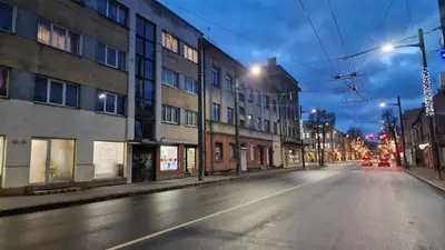 an empty city street at night with street lights at Kaunas Studios - RentA 19 in Kaunas