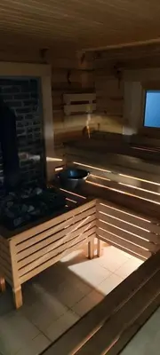 a kitchen with a stove in a room at Tauro Pirtis in Vainiūnai