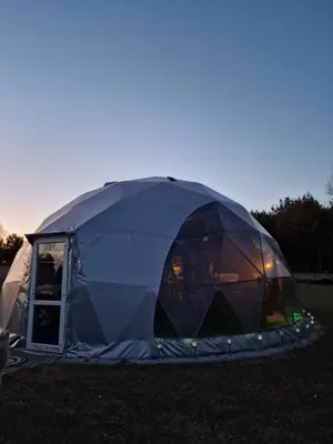 a tent is set up in a field at Rojus dviems in Žaugėdai