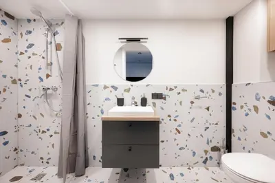a bathroom with a shower and a sink and a toilet at Youston self check-in apartments Vilnius in Vilnius