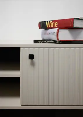 a pile of books sitting on top of a table at King Mindaugas center apartment in Kaunas