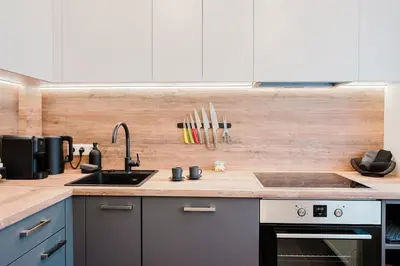 a kitchen with a sink and a counter top at King Mindaugas center apartment in Kaunas