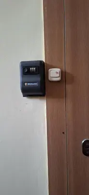 a black door latch on a wooden door at Šiauliai Central Vytauto Apartment in Šiauliai