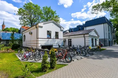a group of bikes parked in front of a building at Rodante Apartments in Druskininkai